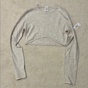 Calvin Klein Women's Cream Cropped Sweater Top with curved hem